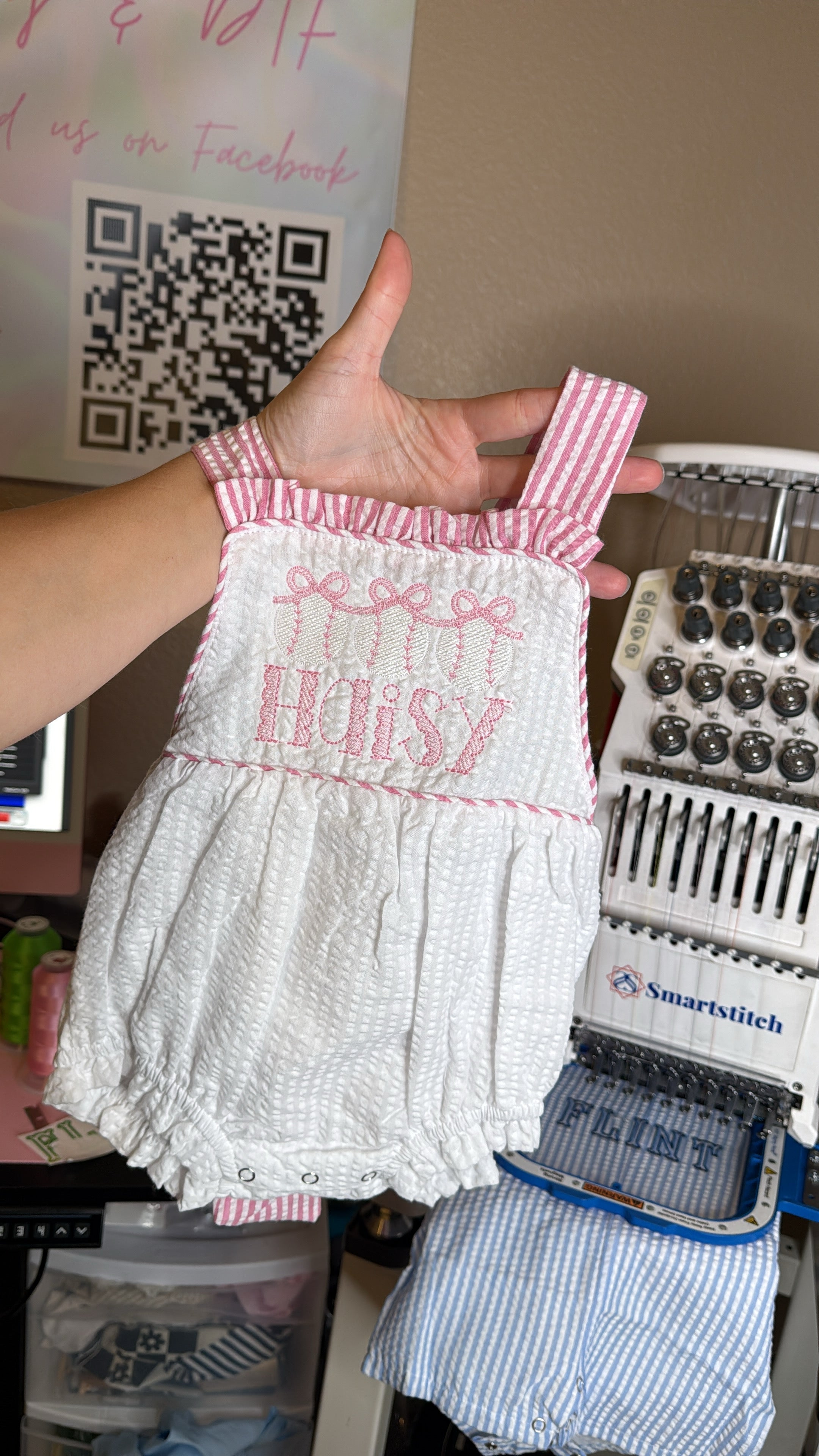 Pink striped sun suit with baseballs and bows